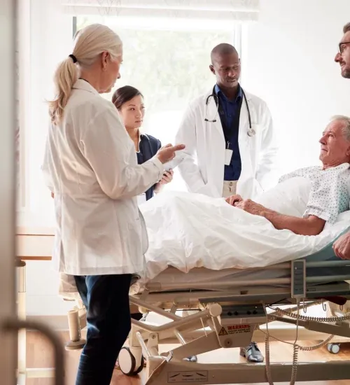 The practice team on rounds with a patient