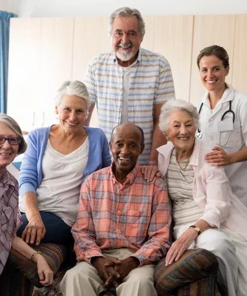 A doctor with senior patients at the practice