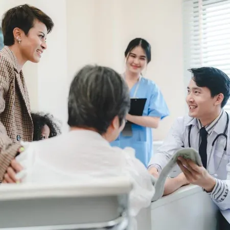 A doctor talking with patients in the waiting area