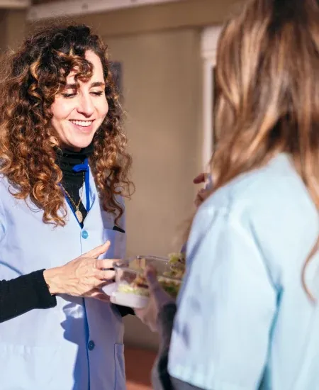 Nurses sharing a friendly conversation